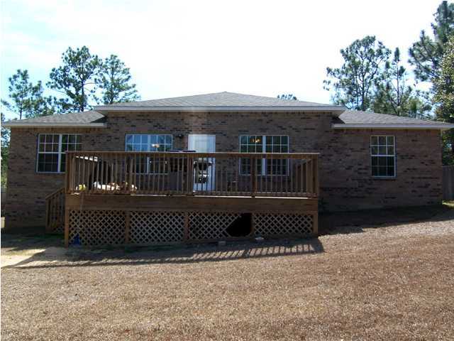 435 Ridge Lake Road Crestview, FL 32536 - Photo 11 of 16 a front view of a house with a garden