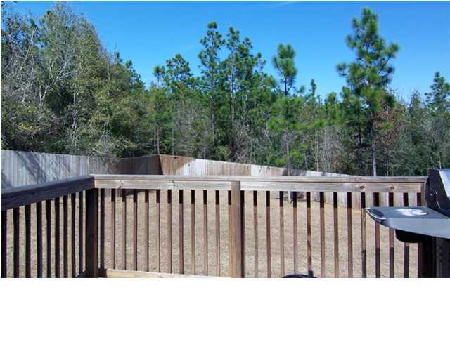 435 Ridge Lake Road Crestview, FL 32536 - Photo 12 of 16 a view of a wooden fence