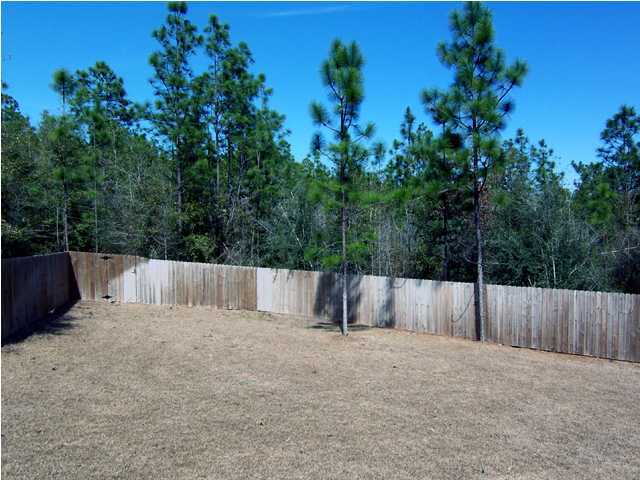 435 Ridge Lake Road Crestview, FL 32536 - Photo 13 of 16 a view of backyard and tree