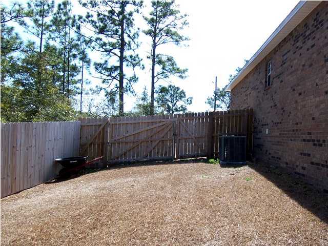 435 Ridge Lake Road Crestview, FL 32536 - Photo 14 of 16 a view of wooden fence