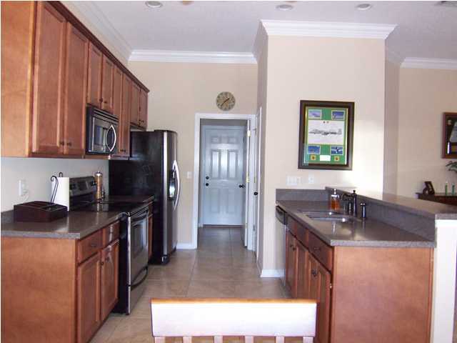 435 Ridge Lake Road Crestview, FL 32536 - Photo 5 of 16 a kitchen with granite countertop a sink stove and refrigerator