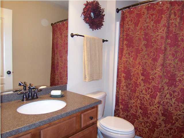 435 Ridge Lake Road Crestview, FL 32536 - Photo 10 of 16 a bathroom with a granite countertop sink and a mirror with toilet