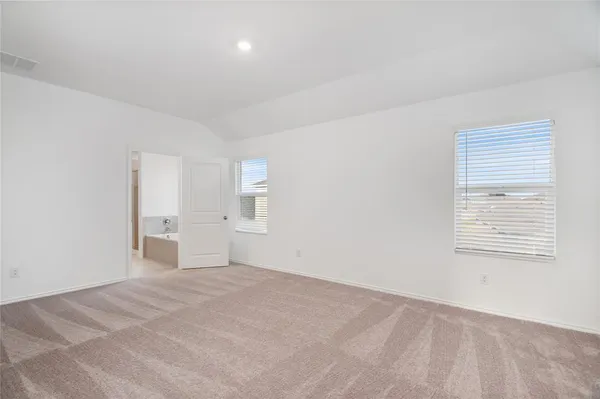 a view of empty room with windows