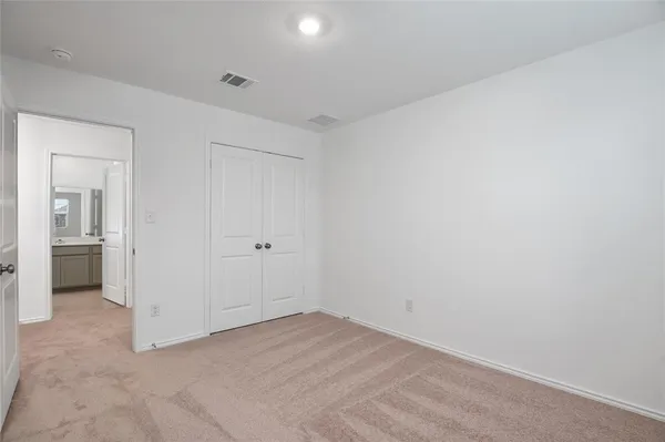 an empty room with a bathroom