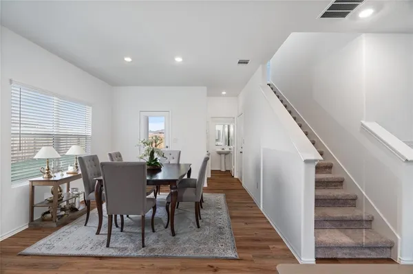 a view of a dining room with furniture