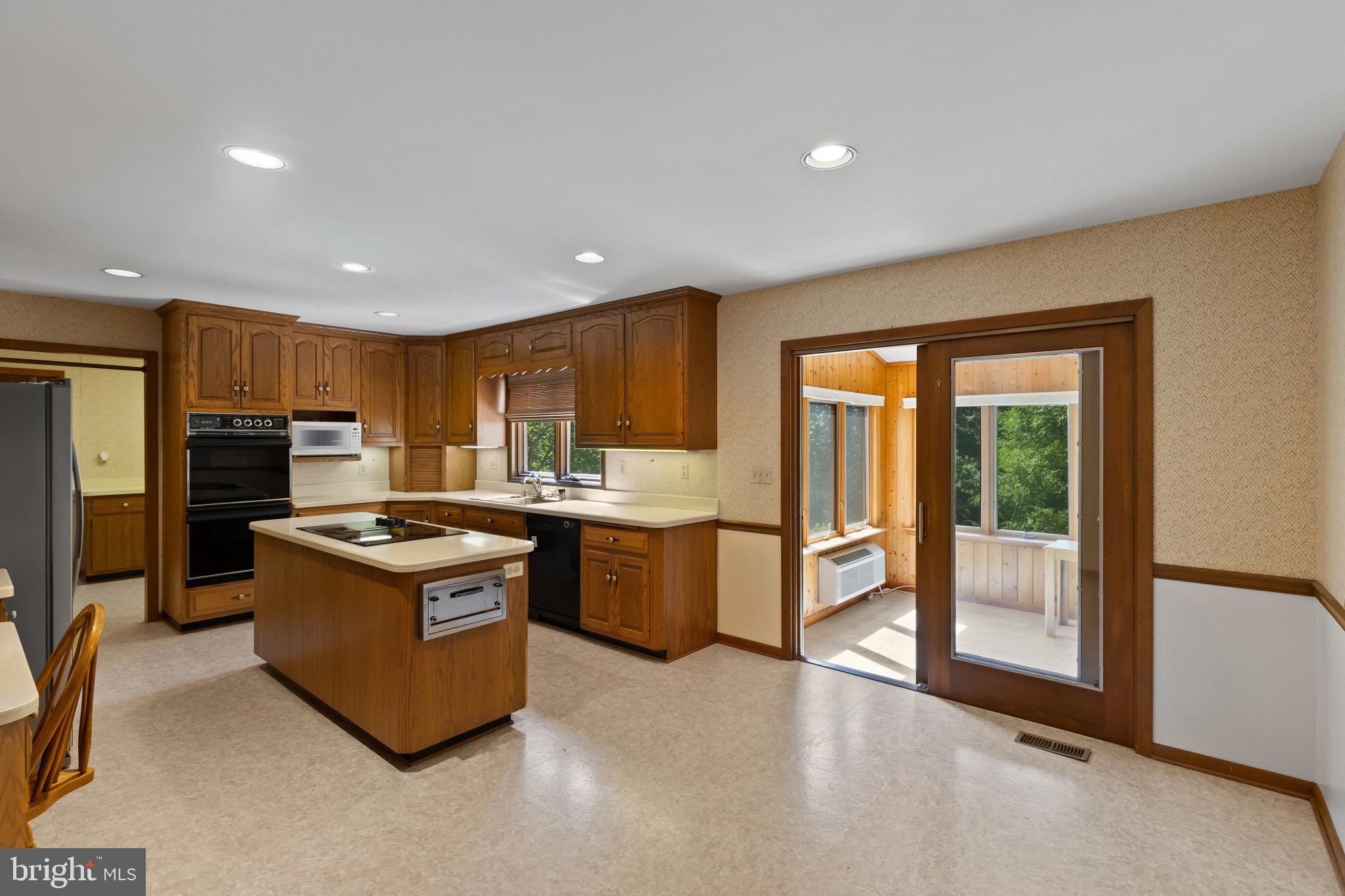 7517 Brooklyn Bridge Road Laurel, MD 20707 - Photo 6 of 41 Kitchen opens to sunroom