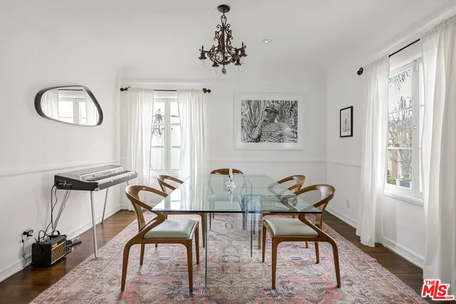 a view of a workspace room with furniture window and wooden floor