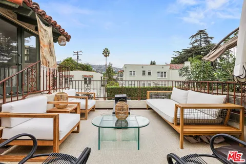 a view of a terrace with furniture