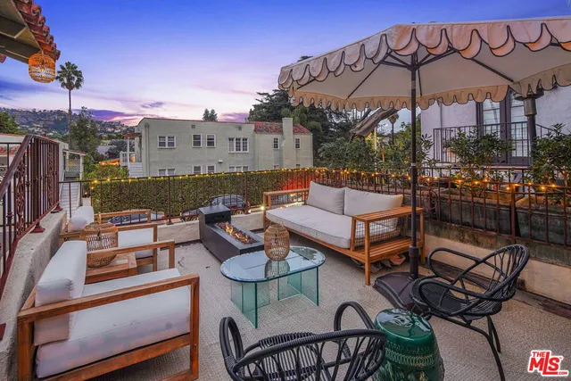 a view of a patio with couches table and chairs