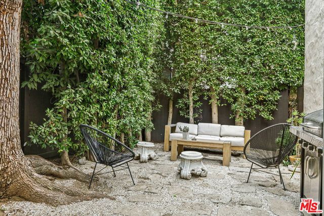 a view of a yard with furniture and a yard