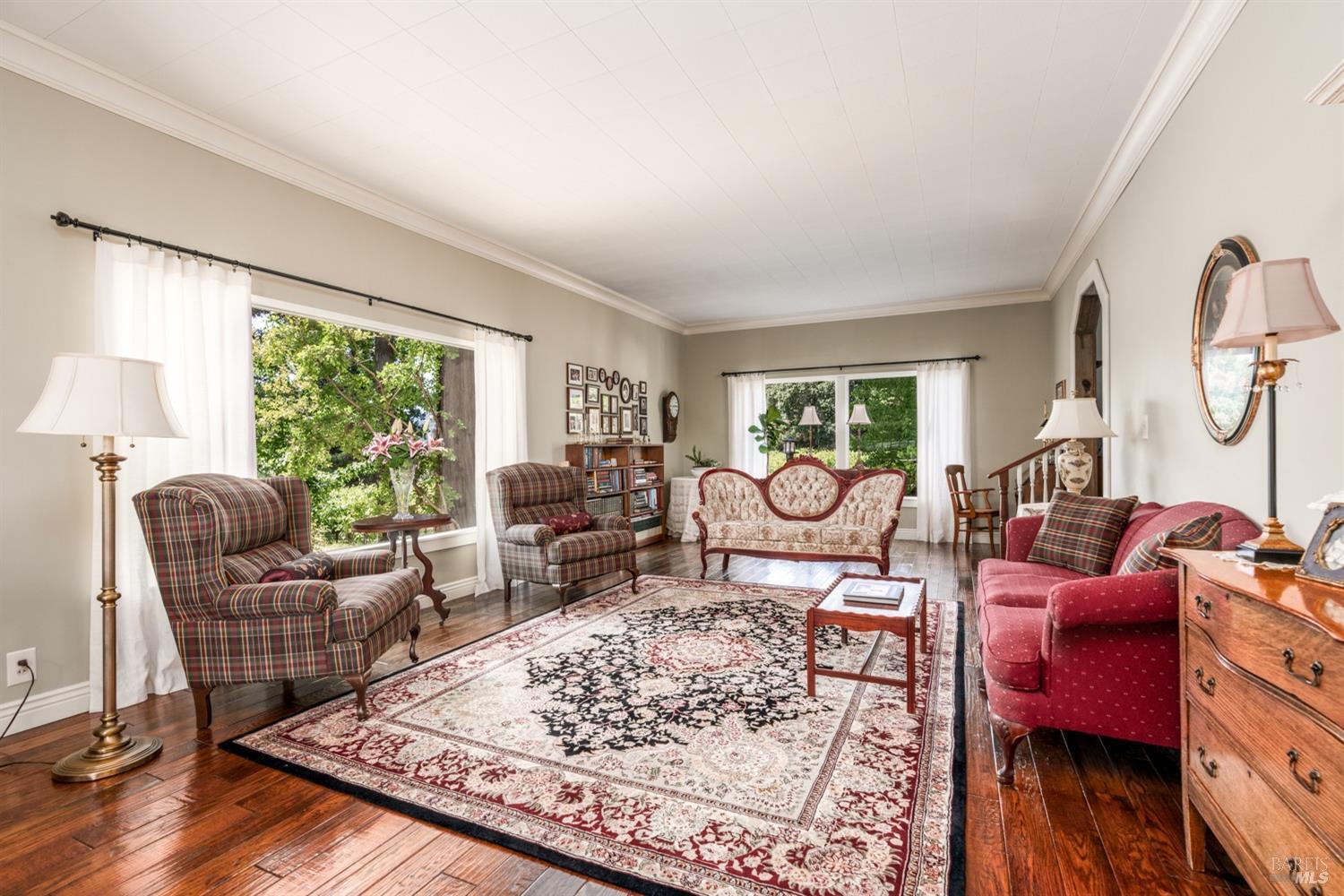5700 Old River Road Ukiah, CA 95482 - Photo 18 of 56 a living room with furniture floor to ceiling window and a table