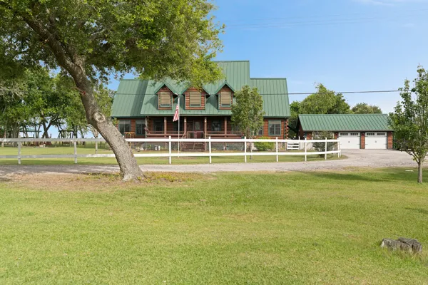 a view of a house with a big yard