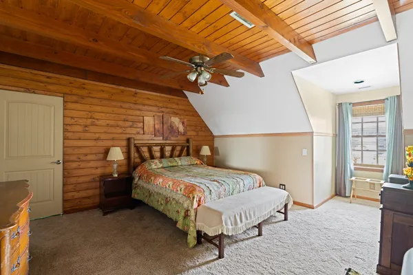 a bedroom with a bed and a table
