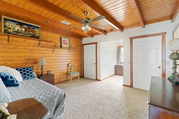 a bedroom with furniture and a table