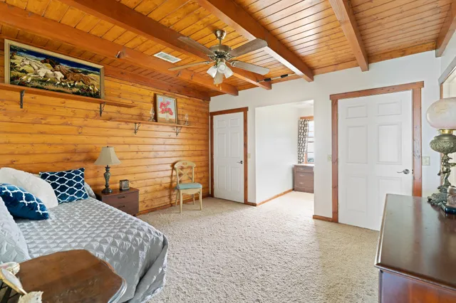 a bedroom with furniture and a table