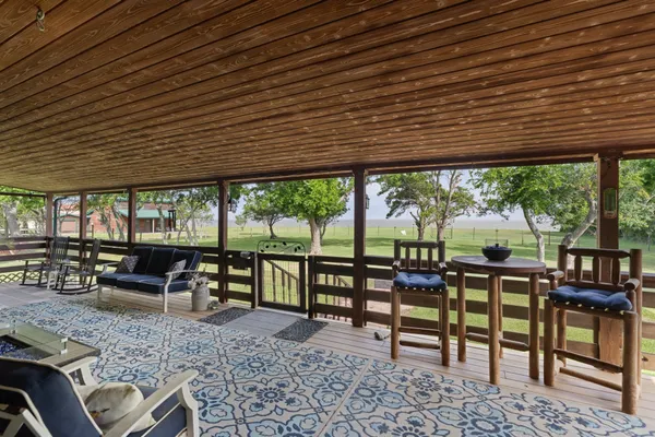 an outdoor sitting area with couch and outdoor seating