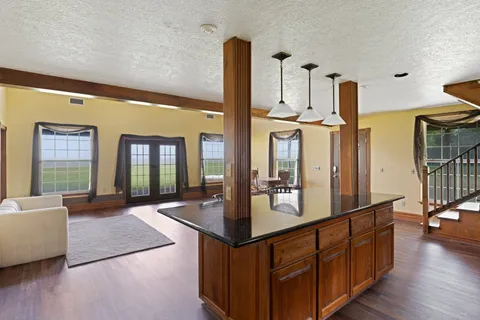 a view of living room with furniture and floor to ceiling window