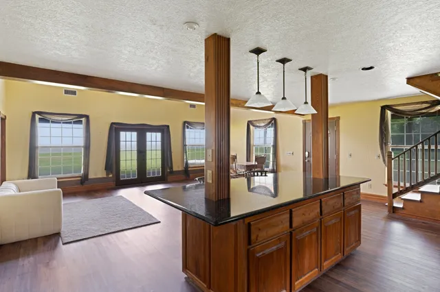 a view of living room with furniture and floor to ceiling window