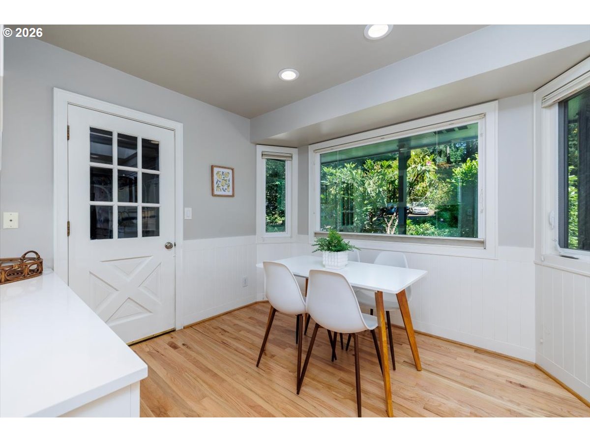 175 Northwest 95th Avenue Portland, OR 97229 - Photo 11 of 46 a workspace with furniture and a wooden floor