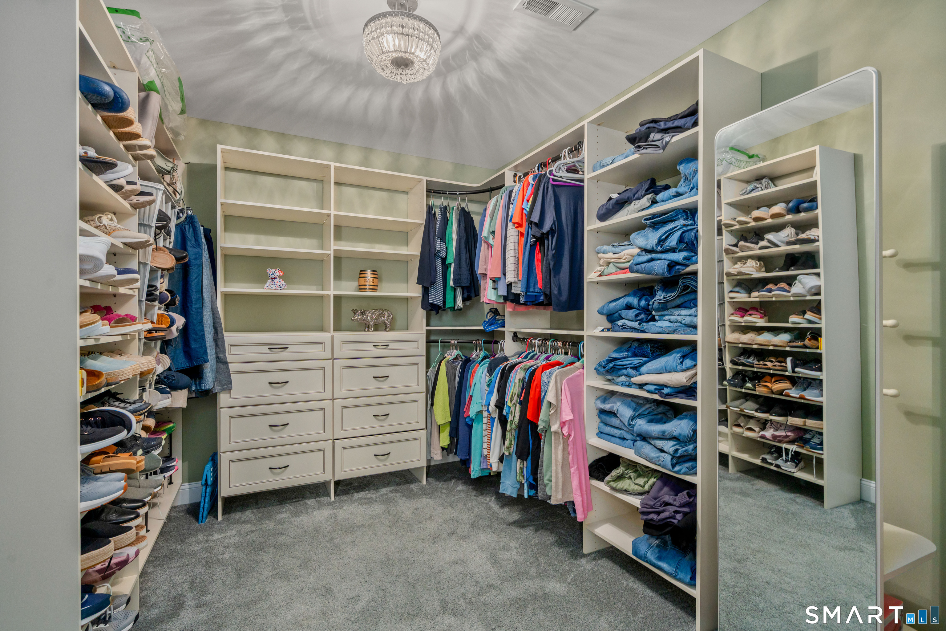 5 Limric Lane Suffield, CT 06078 - Photo 21 of 36 a view of walk in closet with clothes and shoes