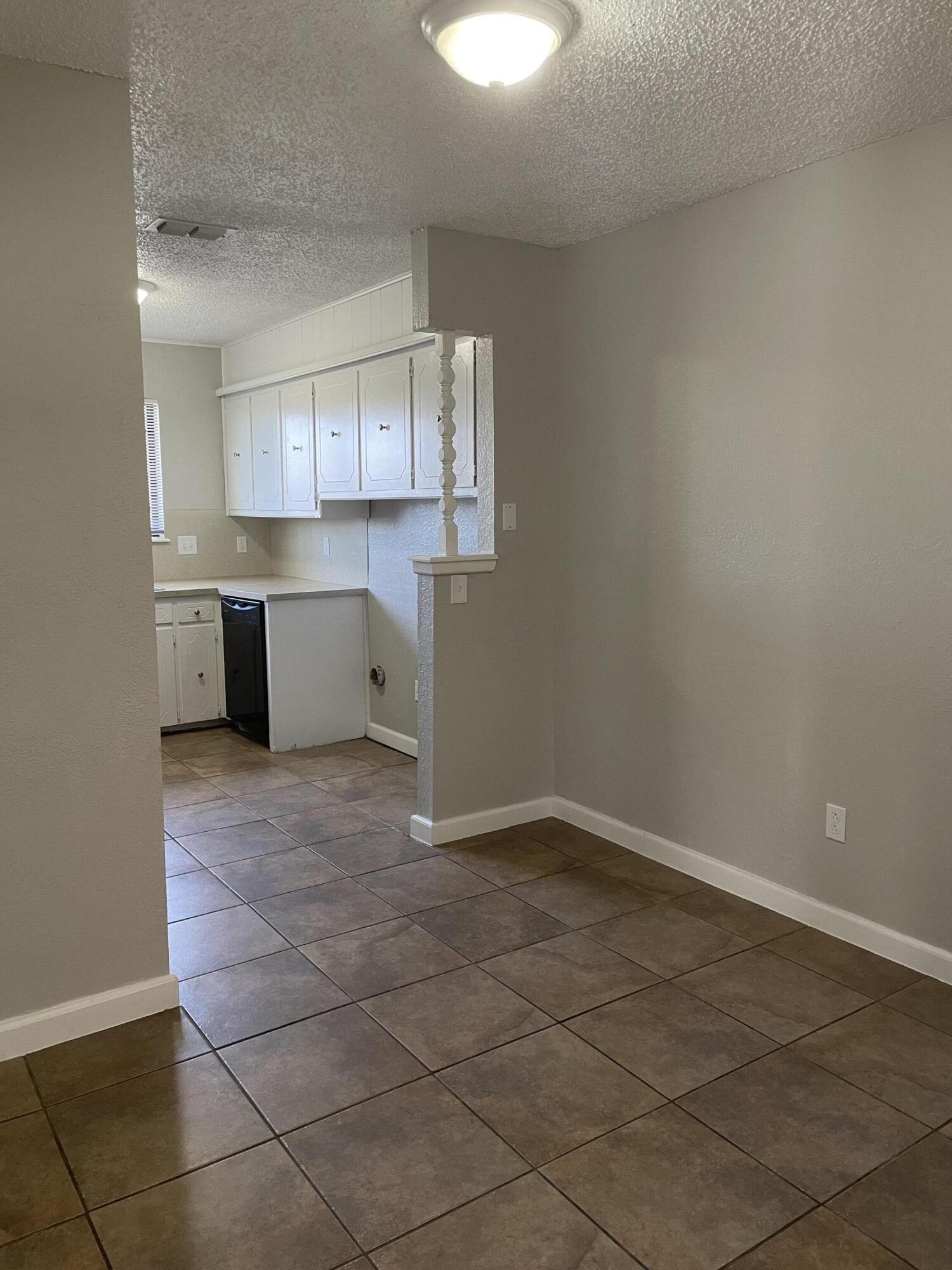 6917 Fremont Avenue Lubbock, TX 79413 - Photo 3 of 9 a room with a cabinets and appliances