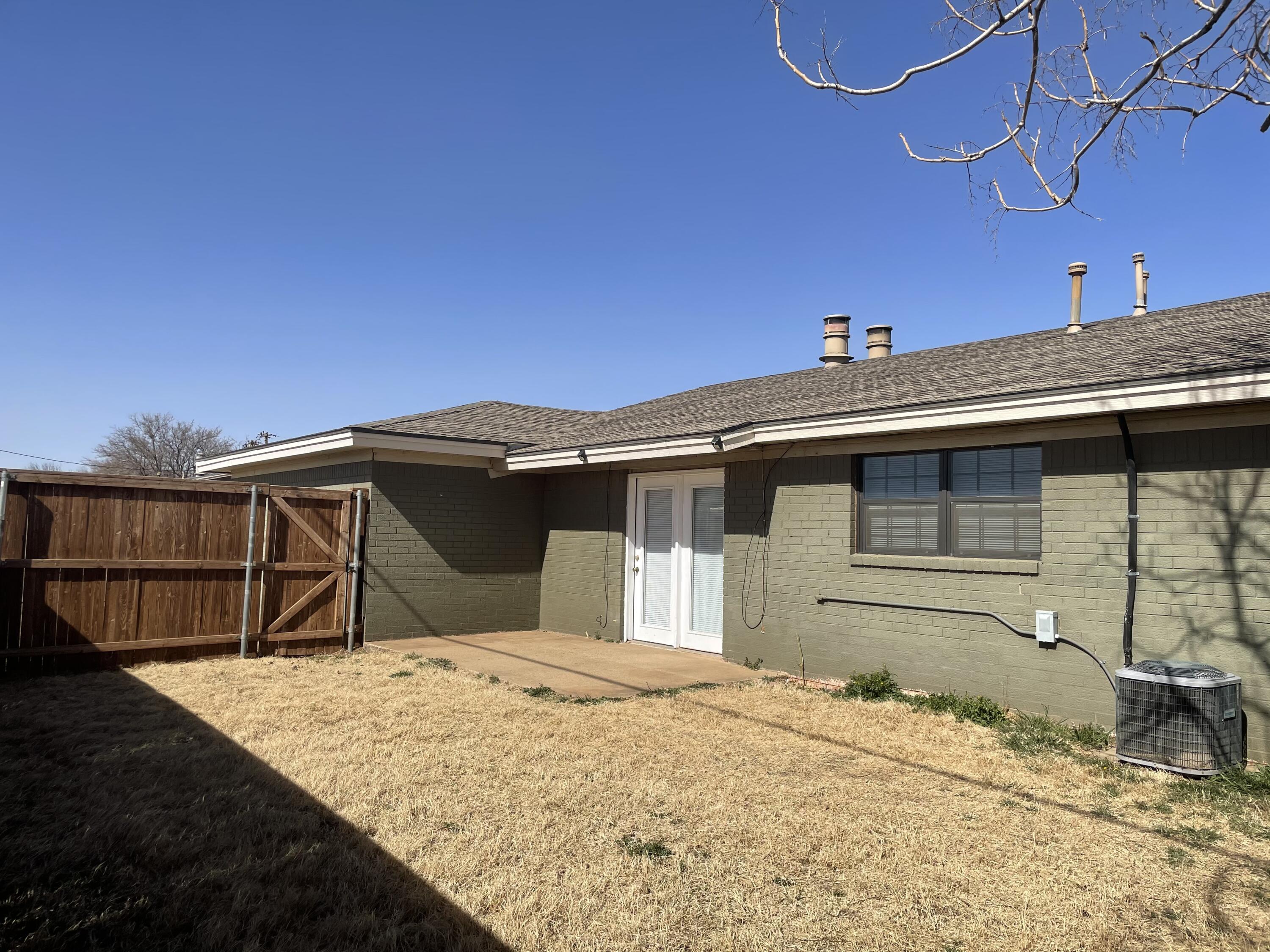 6917 Fremont Avenue Lubbock, TX 79413 - Photo 8 of 9 a view of a wooden house with a roof