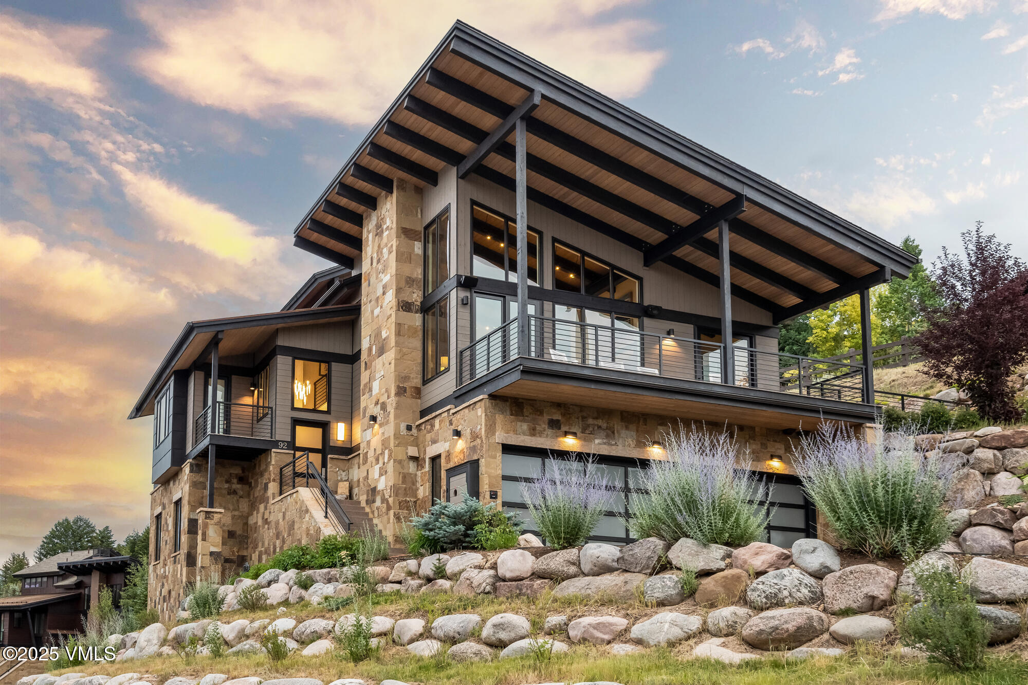 a view of a house with a wooden fence