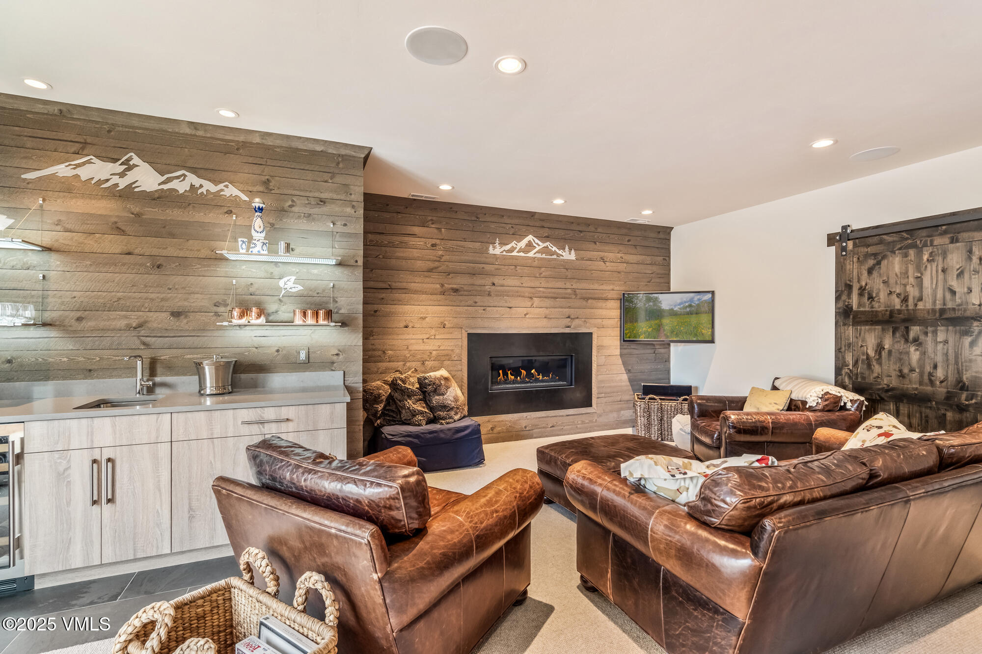 92 Edwards Pointe Edwards, CO 81632 - Photo 44 of 74 a living room with furniture a flat screen tv and a fireplace