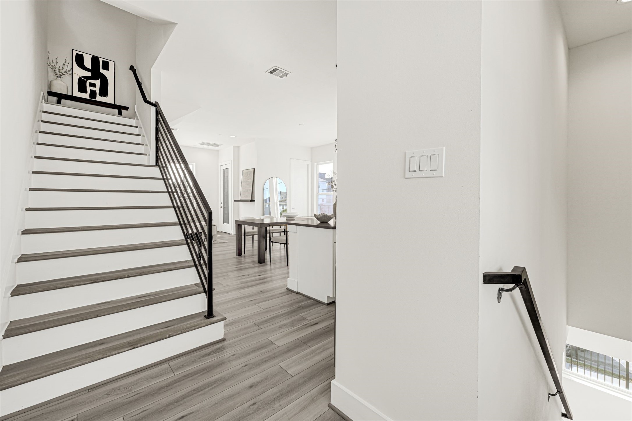 3313 Baer Street Houston, TX 77020 - Photo 7 of 35 a view of entryway and hall with wooden floor