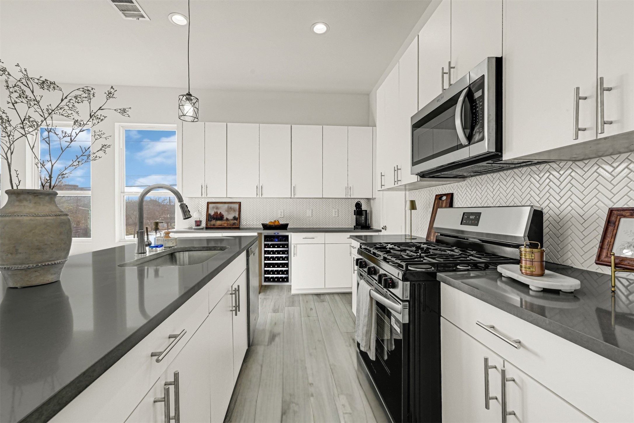 3313 Baer Street Houston, TX 77020 - Photo 8 of 35 a kitchen with stainless steel appliances granite countertop a sink stove and microwave