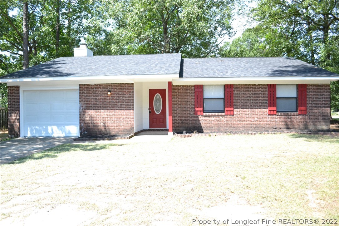982 Rim Road Fayetteville, NC 28314 - Photo 1 of 20 a backyard of a house with barbeque oven and outdoor seating