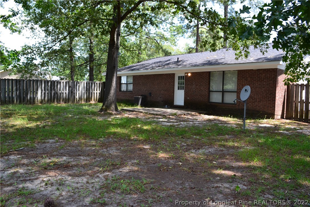 982 Rim Road Fayetteville, NC 28314 - Photo 19 of 20 a view of a house with a yard and tree