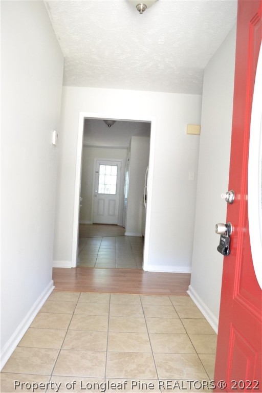 982 Rim Road Fayetteville, NC 28314 - Photo 3 of 20 a view of a hallway to a house with white walls
