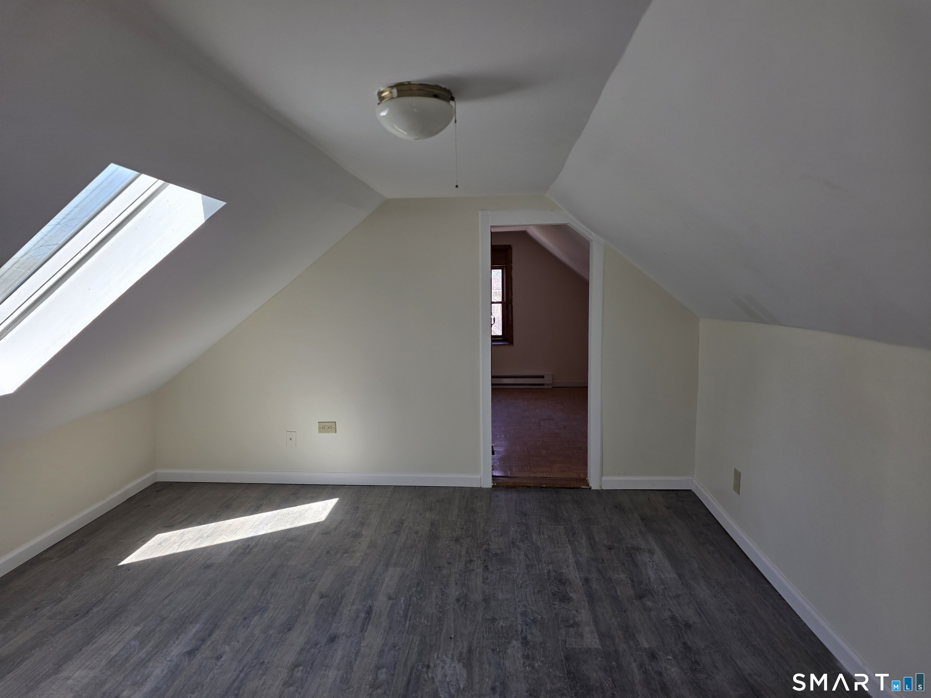 36 Reynolds Street Norwich, CT 06360 - Photo 13 of 17 a view of empty room with wooden floor