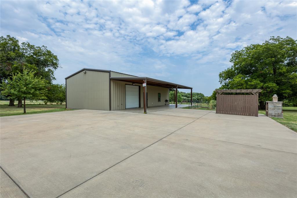 210 Spring Branch Trail North Springtown, TX 76082 - Photo 24 of 36 a house with trees in front of it