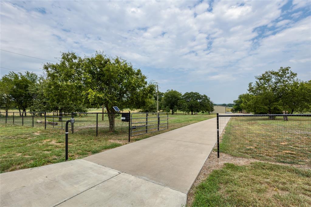 210 Spring Branch Trail North Springtown, TX 76082 - Photo 28 of 36 a view of a lake with a yard