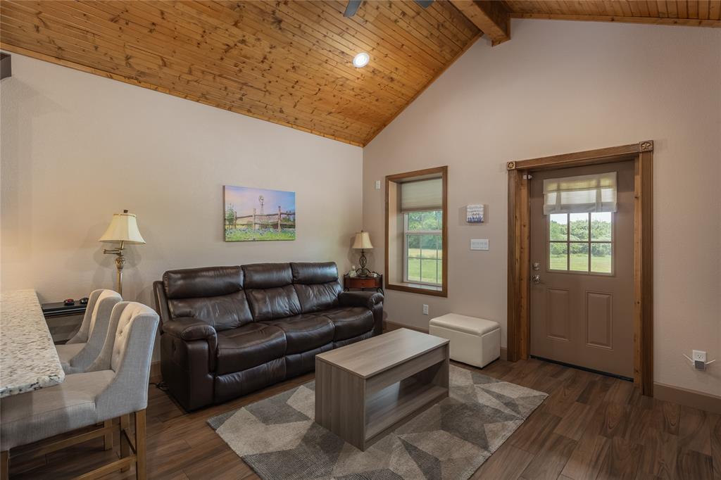210 Spring Branch Trail North Springtown, TX 76082 - Photo 4 of 36 a living room with furniture and a window