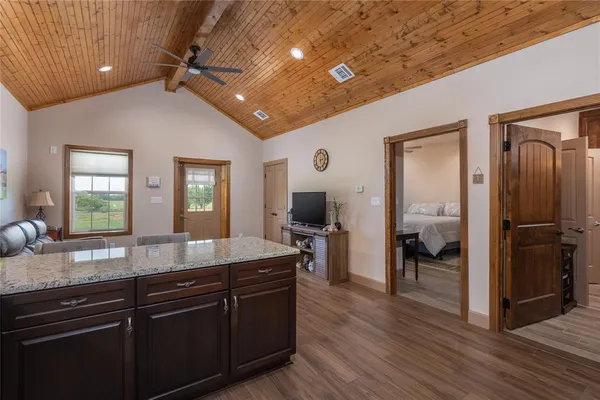 a open kitchen with sink refrigerator and cabinets