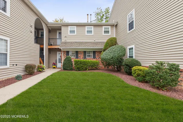 a house that is sitting in the grass