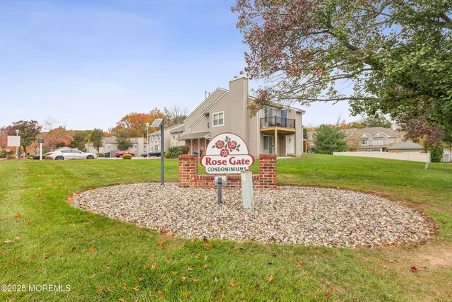 a sign board with yard in front of it