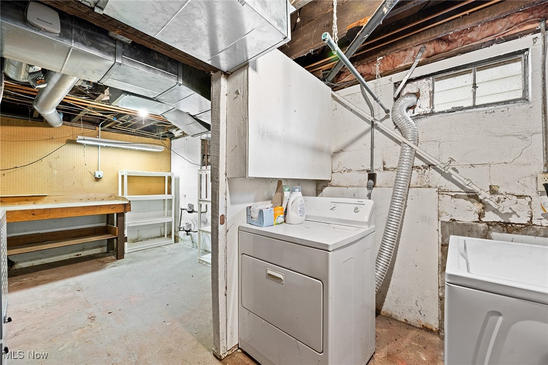 4556 Fishcreek Road Stow, OH 44224 - Photo 25 of 41 Laundry area with concrete floors and washing machine and clothes dryer