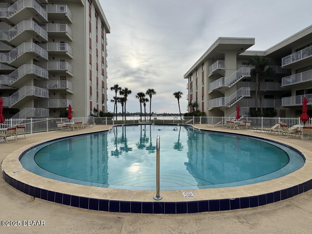 2711 North Halifax Avenue, Unit 385 Daytona Beach, FL 32118 - Photo 13 of 18 a view of a swimming pool with a lake view