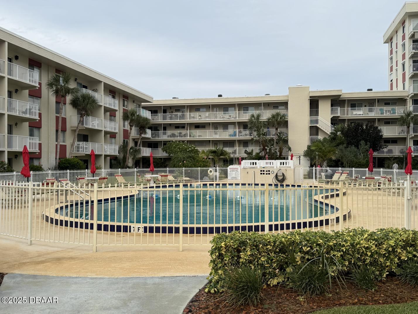 2711 North Halifax Avenue, Unit 385 Daytona Beach, FL 32118 - Photo 15 of 18 a view of a building with a garden