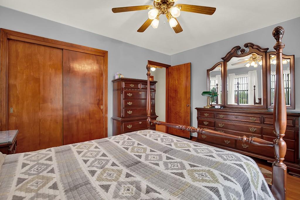 1689 4th Street Monongahela, PA 15063 - Photo 11 of 31 a bedroom with a large bed and a chandelier