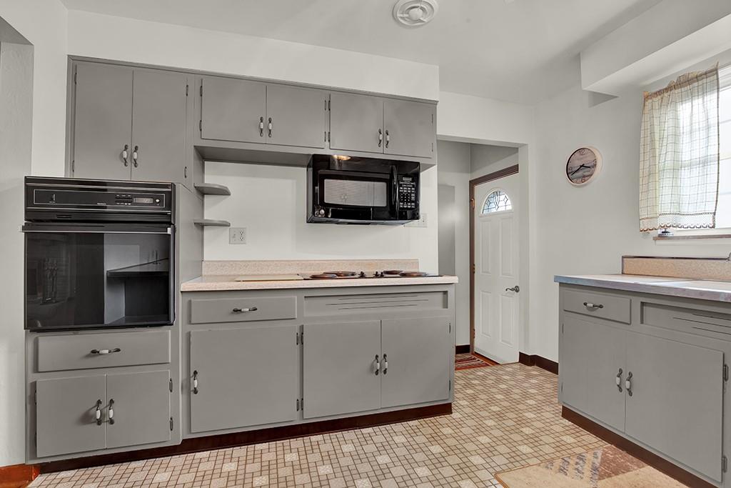 1689 4th Street Monongahela, PA 15063 - Photo 20 of 31 a kitchen with granite countertop white cabinets and stainless steel appliances