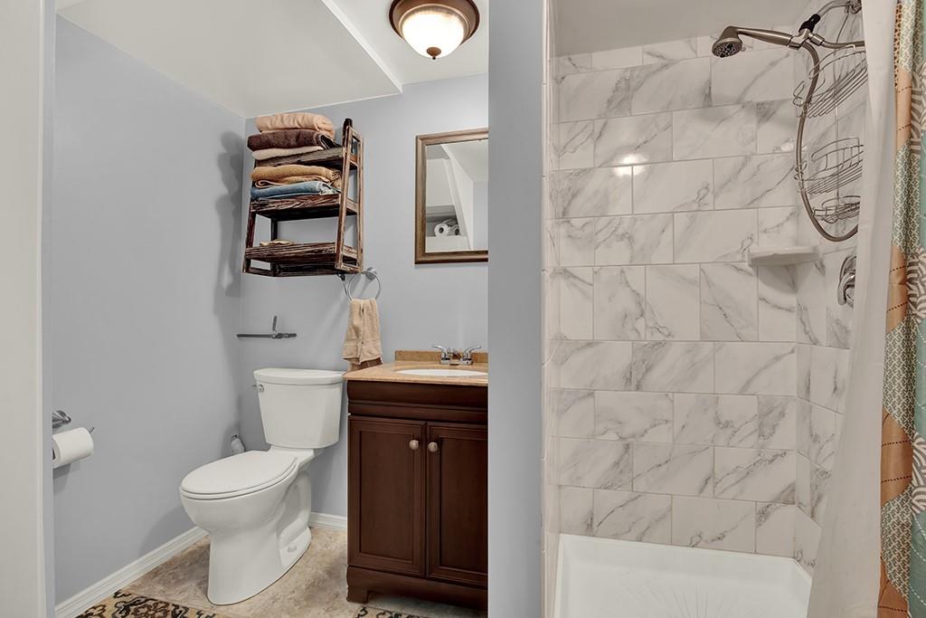 1689 4th Street Monongahela, PA 15063 - Photo 21 of 31 a bathroom with a toilet a sink and mirror