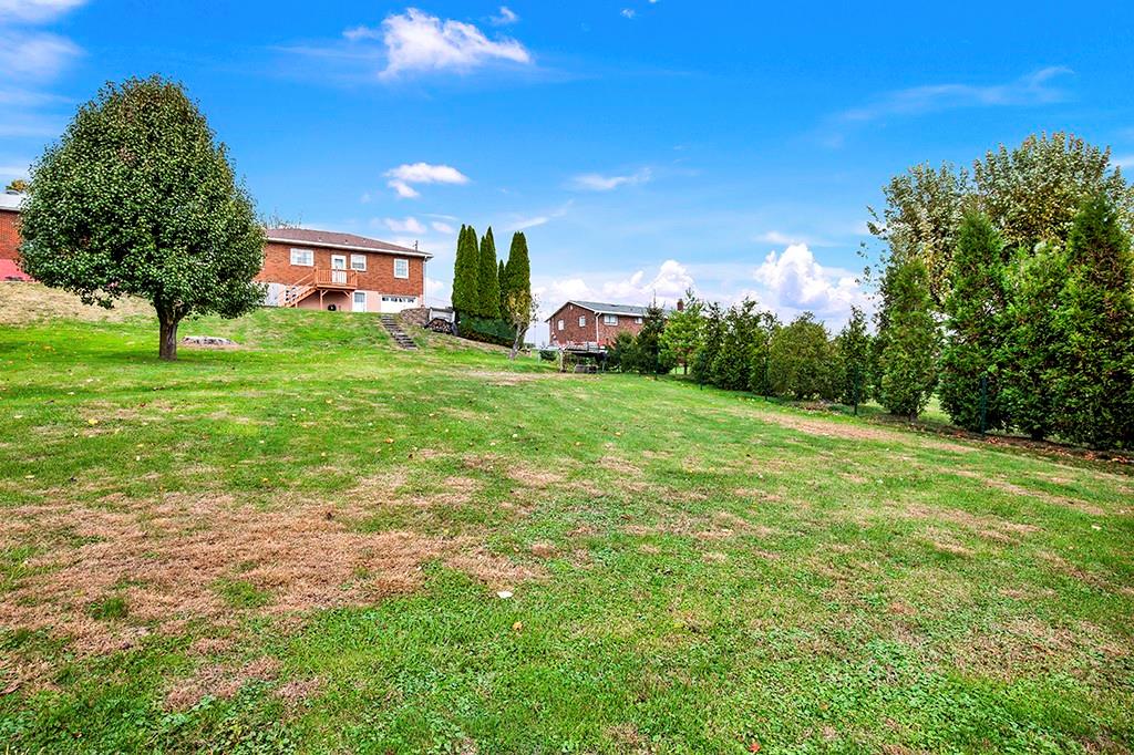 1689 4th Street Monongahela, PA 15063 - Photo 26 of 31 a front view of a house with a yard