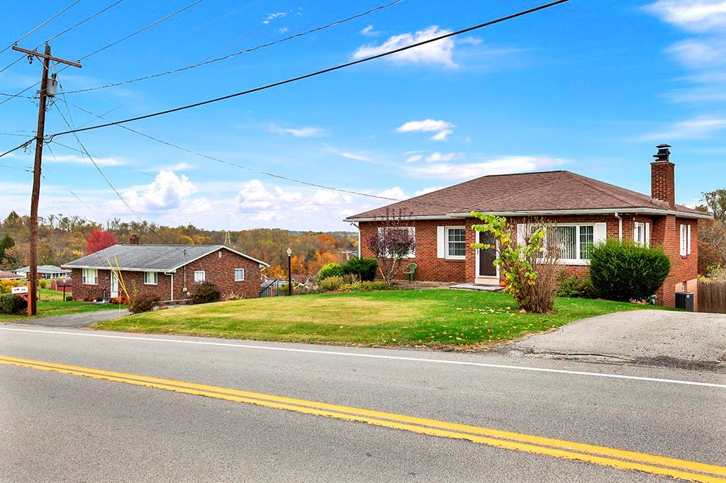 1689 4th Street Monongahela, PA 15063 - Photo 29 of 31 a front view of a house with a garden and pathway