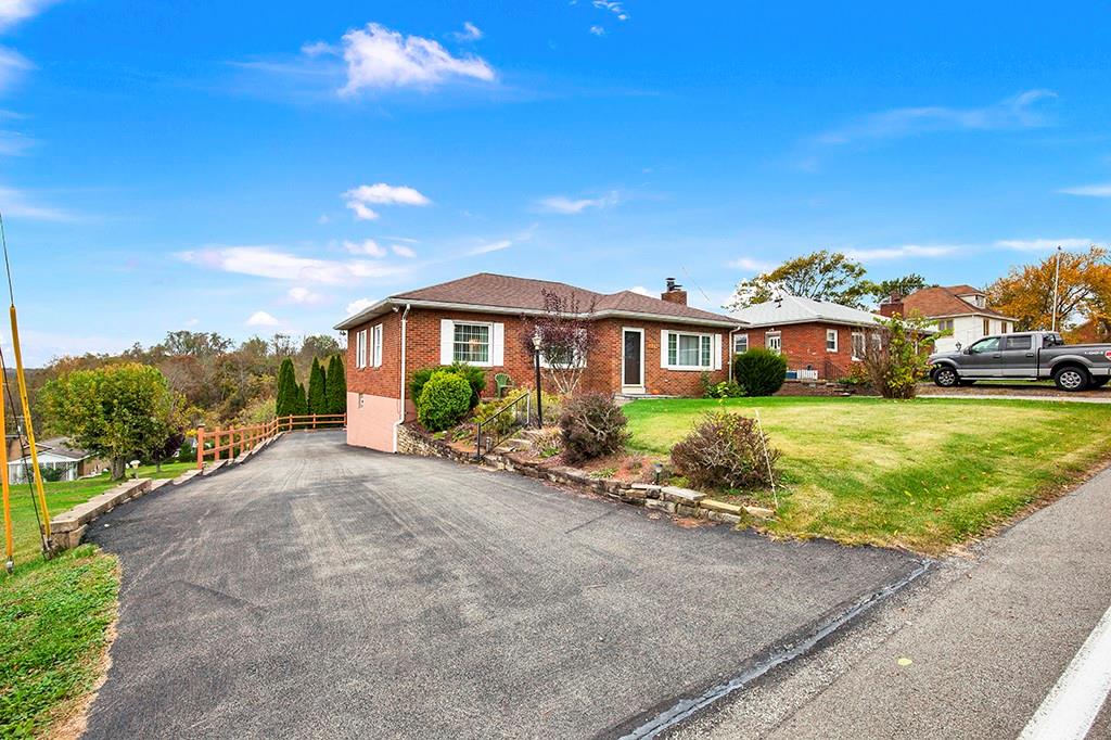 1689 4th Street Monongahela, PA 15063 - Photo 31 of 31 a view of a house with a yard and potted plants