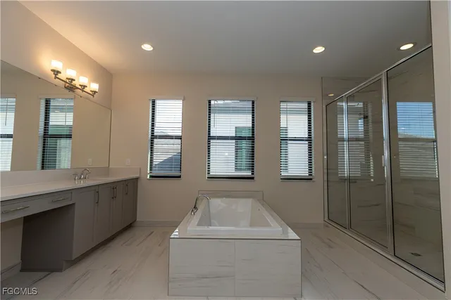 a front view of a house with a garden and yard